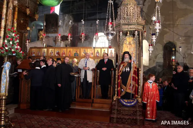 Greek Orthodox Patriarch of Jerusalem Metropolitan Theophilos leads the Orthodox Christmas procession inside the Church of the Nativity in the West Bank town of Bethlehem January 6, 2012. Photo by Issam Rimawi