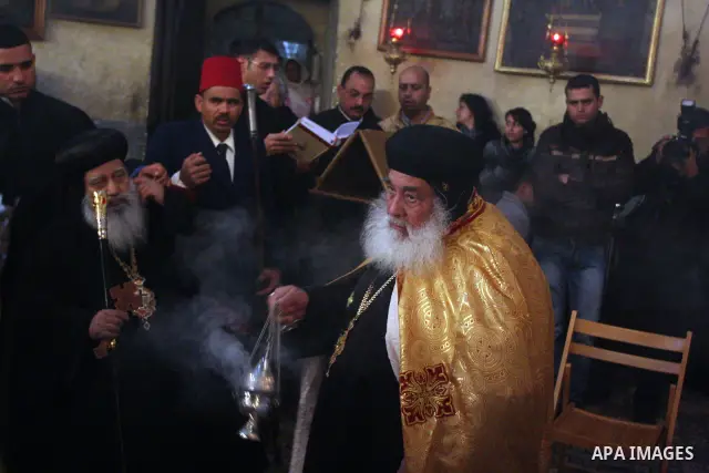 Greek Orthodox priests attend the Christmas procession inside the Church of the Nativity in the West Bank town of Bethlehem January 6, 2012. Photo by Issam Rimawi