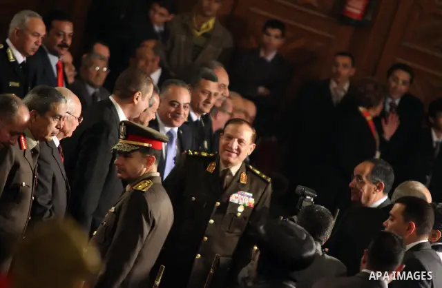 General Sami Anan (3rd R), Army chief of Staff and member of the SCAF at the Supreme Council of the Armed Forces, and other high-ranking military officials attend the Coptic Christmas eve mass at the main cathedral in Ca...