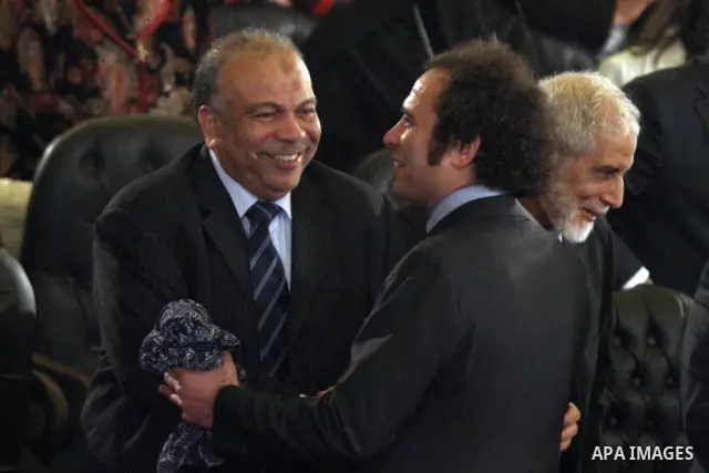 the party's Secretary General Saad al-Katatni during the Coptic Christmas mass held at the Abassiya Cathedral in Cairo, Egypt, late 06 January 2012. According to media reports, Egyptian Coptic Christians are marking thei...