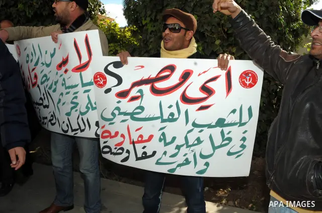 Tunisian Islamist Ennahdha Party supporters cheer as they greet of Palestinian Prime Minister in gaza strip, Ismail Haniya on January 7, 2012 in Tunis. Photo by Mohammed Al-Ostaz