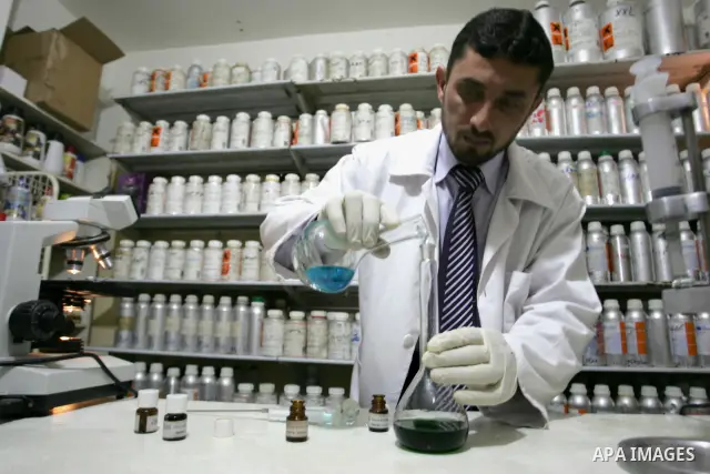 A Palestinian man corks a perfume bottle manufactured and sold locally in the Rafah refugee camp in the southern Gaza Strip on January 8, 2012. A report released in October 2011 by the World Bank, reveals a precarious ec...