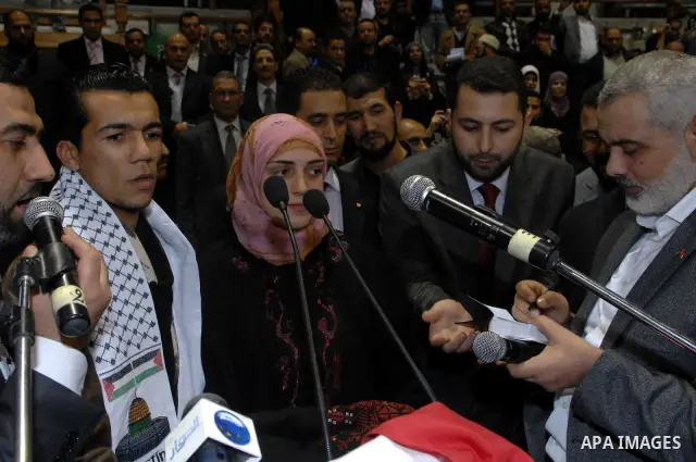 A French woman announces her Islam during a speech delivered by Ismail Haniya, prime minister in the Hamas-ruled in Gaza Strip, on January 8, 2012 in Tunis. A visit by Gaza's Hamas leader has angered the official Palesti...