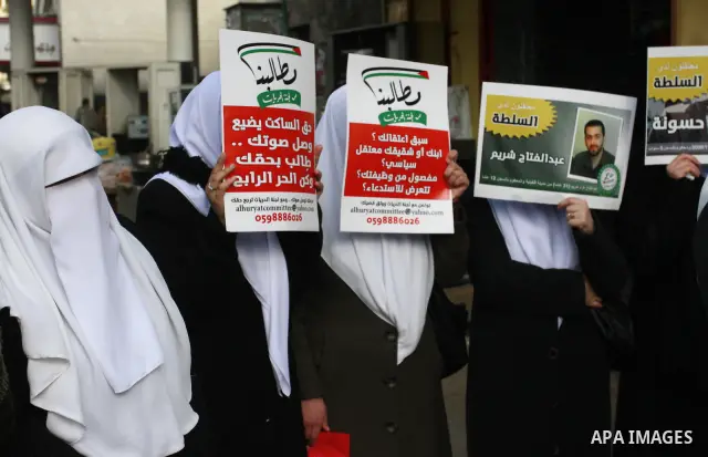 Palestinian Hamas supporters hold up pictures of relatives who were arrested and imprisoned for political reasons by Palestinian Authority security forces, during a protest in the West Bank city of Nablus, on Jan. 09, 20...