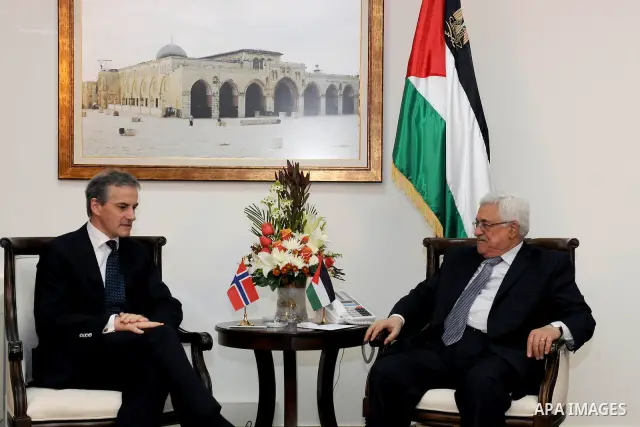Palestinian President Mahmoud Abbas, right, and Norway's Foreign Minister Jonas Gahr Store meet in the West Bank city of Ramallah, Thursday, Jan. 12, 2012. Photo by Thaer Ghanaim