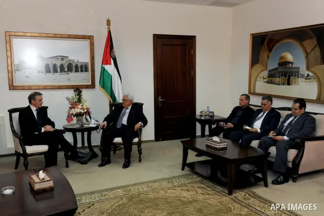 Palestinian President Mahmoud Abbas, right, and Norway's Foreign Minister Jonas Gahr Store meet in the West Bank city of Ramallah, Thursday, Jan. 12, 2012. Photo by Thaer Ghanaim