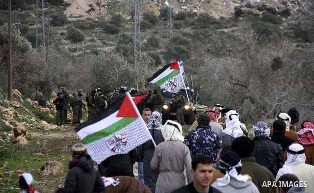 Palestinian protesters clash with Israeli troops during a weekly protest against the Jewish settlement of Qadomem, near Nablus, the West Bank, 13 January 2012. Ten Palestinians and two journalists were reportedly wounded...