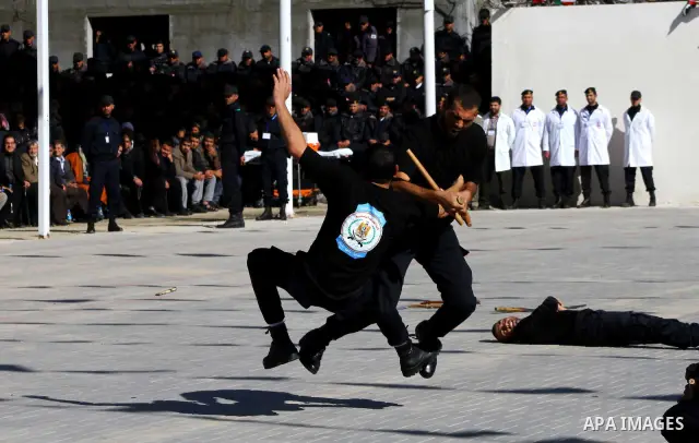 Palestinian members of Hamas security forces during perform mock exercises during a graduation ceremony in Gaza City in Gaza City on Jan. 16, 2012. Photo by Ashraf Amra