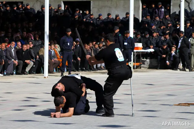 Palestinian members of Hamas security forces during perform mock exercises during a graduation ceremony in Gaza City in Gaza City on Jan. 16, 2012. Photo by Ashraf Amra
