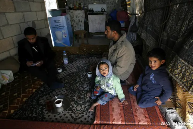 Palestinian family of five persons lives below the poverty line in a refugee camp of Khan Younis in southern Gaza Strip on January 16, 2012. By the third anniversary of the war on Gaza, the agency of the United Nations R...
