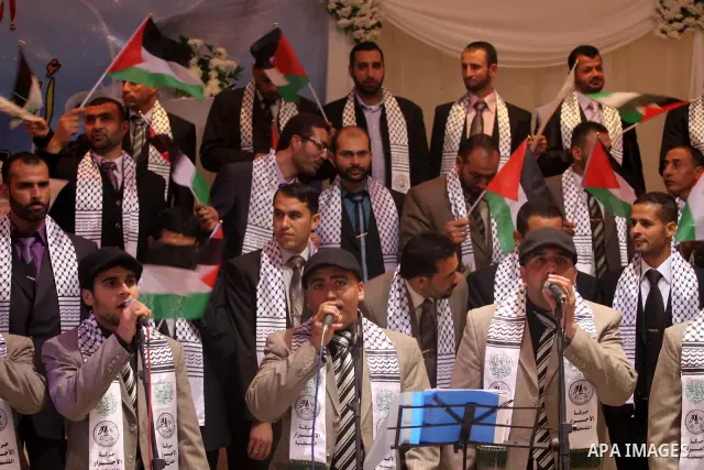 Palestinian bridegrooms attend a mass wedding organized by Waed Association for around 50 released Palestinian prisoners in Gaza city on January 17, 2012. Israel freed 550 Palestinian prisoners on December 19, 2011, comp...