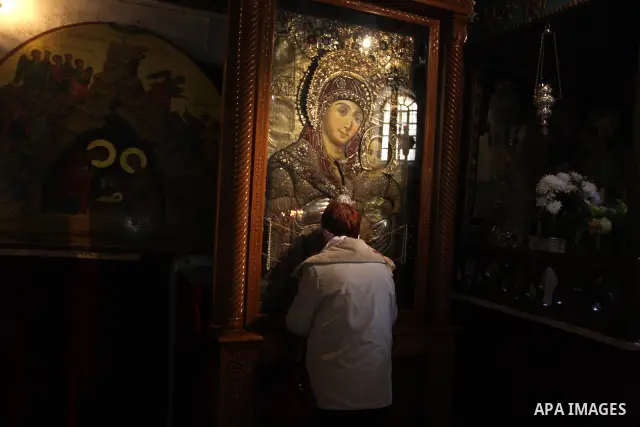 Christians celebrate during an Armenian Christmas procession in the Church of the Nativity in West Bank city of Bethlehem, Wednesday, Jan. 18, 2012. The Armenian Orthodox church in the Holy Land celebrates Christmas on J...