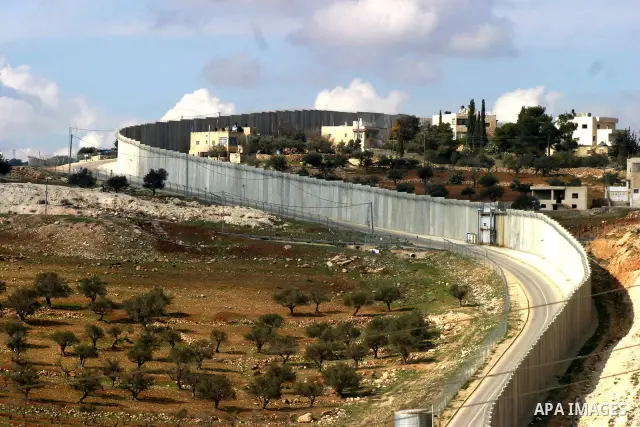 A view shows a section of Israel's controversial concrete barrier that separates the West Bank from Jerusalem on Jan.18, 2012. in Abu Dis, in Israeli-annexed east Jerusalem. Photo by Mahfouz Abu Turk