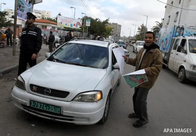 Palestinians members of ministry of Agriculture hold posters during in a protest calling for support the national products, in Gaza City, on Jan. 19, 2012. Photo by Mohammed Asad