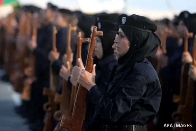 Palestinian female security forces loyal to Palestinian President Mahmoud Abbas march with mock weapons during a graduation ceremony in the West Bank city of Jericho, Thursday, Jan. 19, 2012. Photo by Issam Rimawi