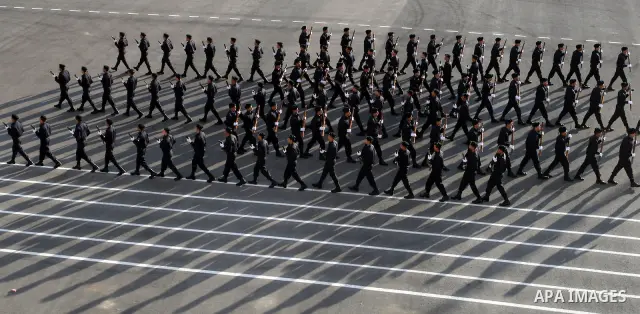 Palestinian security forces loyal to Palestinian President Mahmoud Abbas march with mock weapons during a graduation ceremony in the West Bank city of Jericho, Thursday, Jan. 19, 2012. Photo by Issam Rimawi