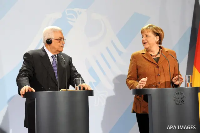 Palestinian president Mahmud Abbas meets with the German chancellor Angela Merkel at the Chancellery in Berlin on January 19, 2012. Photo by Thaer Ganaim