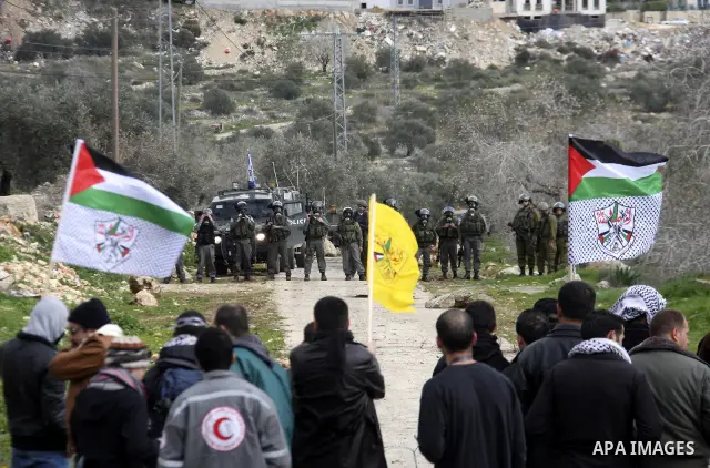 Israeli border officers clash with Palestinian demonstrators during a protest in the village of Kufr Qaddum, near the Israeli settlement of Kdumim, in the northern West Bank, Friday, Jan. 20, 2012. Photo by Wagdi Eshtaya...