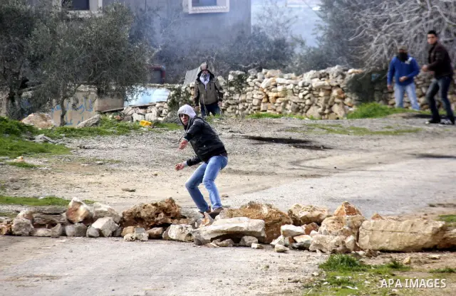 Israeli border officers clash with Palestinian demonstrators during a protest in the village of Kufr Qaddum, near the Israeli settlement of Kdumim, in the northern West Bank, Friday, Jan. 20, 2012. Photo by Wagdi Eshtaya...