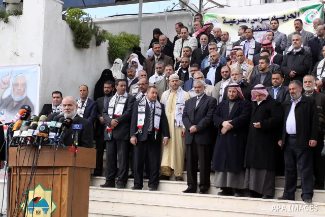 Palestinian Legislative Council members participate in a press conference during a protest in Gaza City on January 21, 2012 in solidarity with Palestinian parliamentary speaker and Hamas member Aziz Dweik, who was arrest...