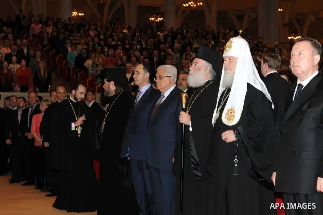 Palestinian President Mahmoud Abbas (Abu Mazen) receives the award of the late Alexei II from the Patriarch of Moscow and all Russia Patriarch Kirill I, in Moscow, on Jan. 21, 2012. Photo by Thaer Ganaim