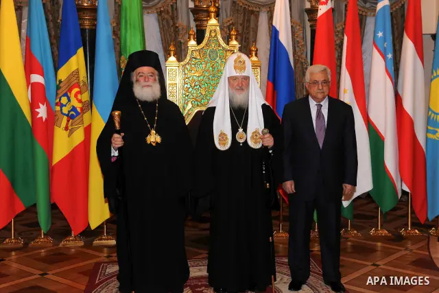 Palestinian President Mahmoud Abbas (Abu Mazen) receives the award of the late Alexei II from the Patriarch of Moscow and all Russia Patriarch Kirill I, in Moscow, on Jan. 21, 2012. Photo by Thaer Ganaim