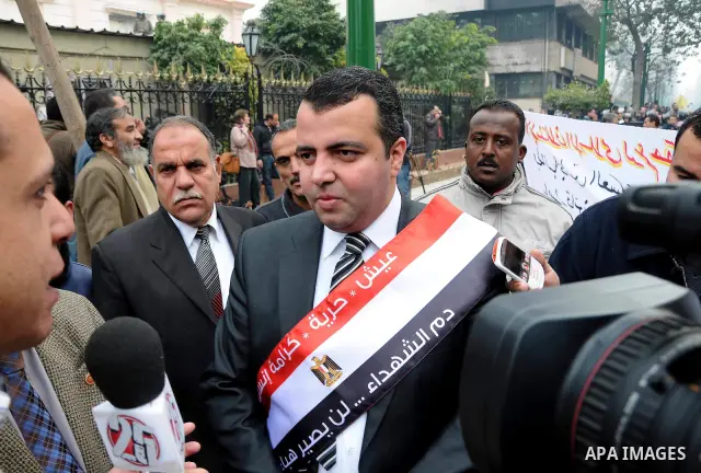 Egyptian parliament member speaks to media upon his arrival for the first parliament session after the revolution that ousted former President Hosni Mubarak, in Cairo January 23, 2012. Egypt's parliament began its first...
