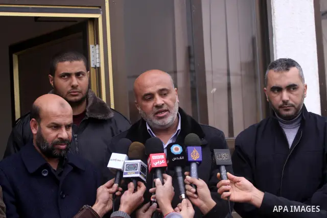 Palestinian members of Interior Ministry and the Central Elections Commission (CEC) members open the organization headquarters in Gaza city on Jan. 24,2012. The head of the regional office of the central elections commis...
