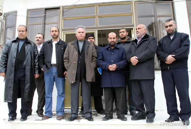 Palestinian members of Interior Ministry and the Central Elections Commission (CEC) members open the organization headquarters in Gaza city on Jan. 24,2012. The head of the regional office of the central elections commis...