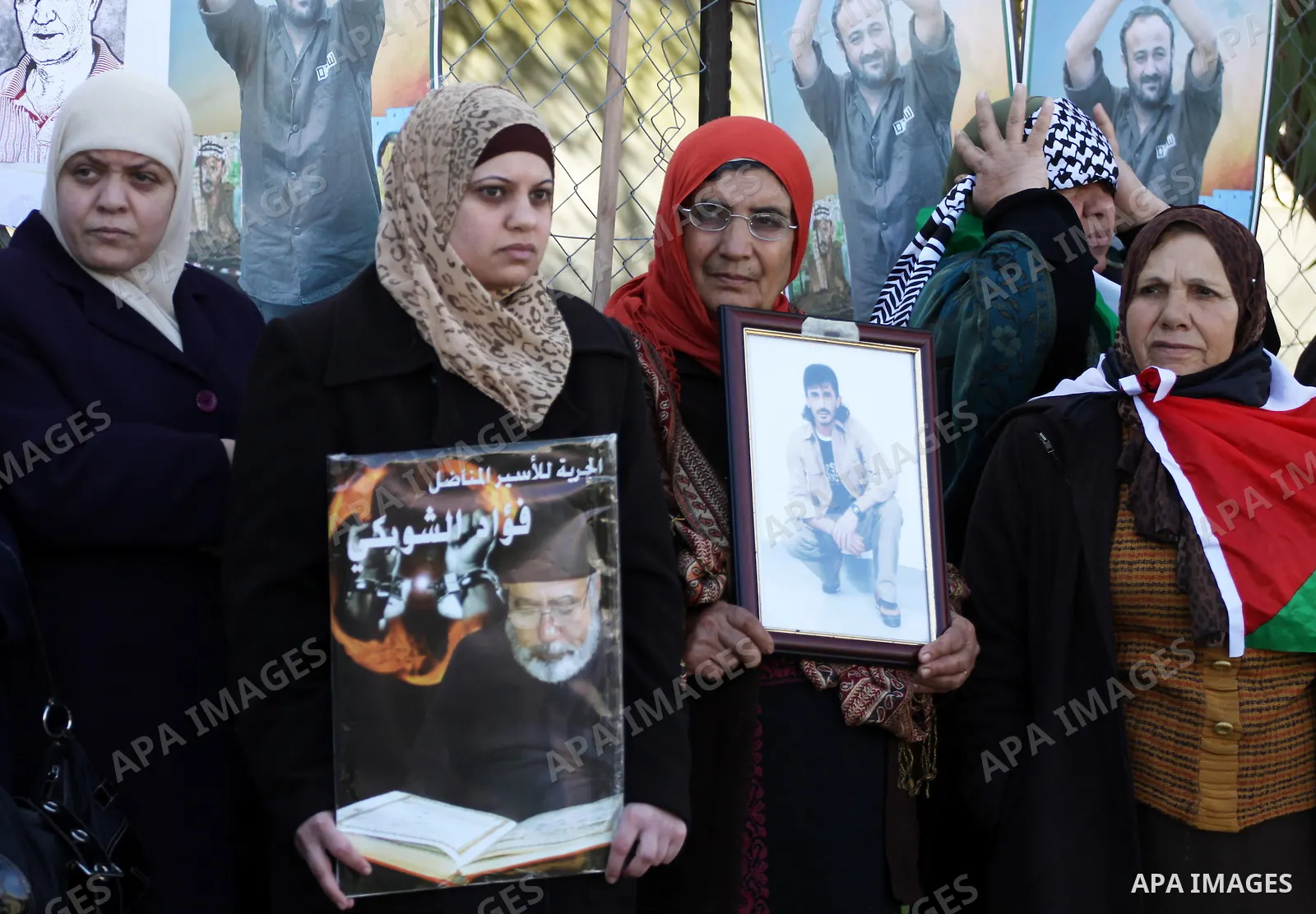 Relatives of Palestinian prisoners held in Israeli jails protest in front the International Committee of the Red Cross (ICRC) offices in the West Bank town of Ramallah, 24 January 2012, during a protest organized by the...