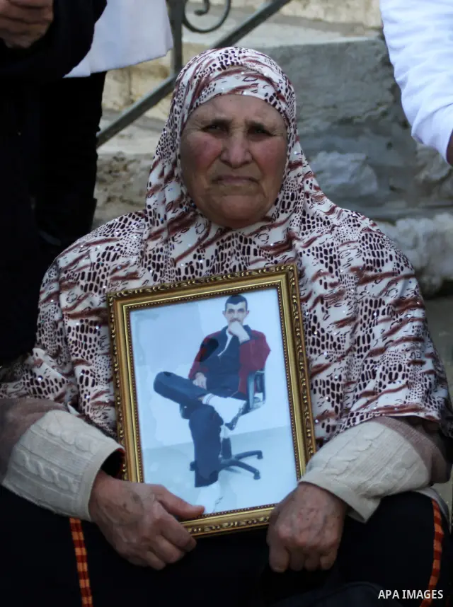 Relatives of Palestinian prisoners held in Israeli jails protest in front the International Committee of the Red Cross (ICRC) offices in the West Bank town of Ramallah, 24 January 2012, during a protest organized by the...
