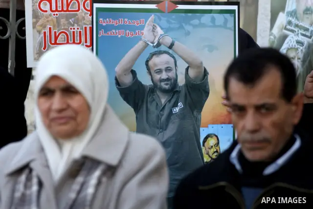 Relatives of Palestinian prisoners held in Israeli jails protest in front the International Committee of the Red Cross (ICRC) offices in the West Bank town of Ramallah, 24 January 2012, during a protest organized by the...