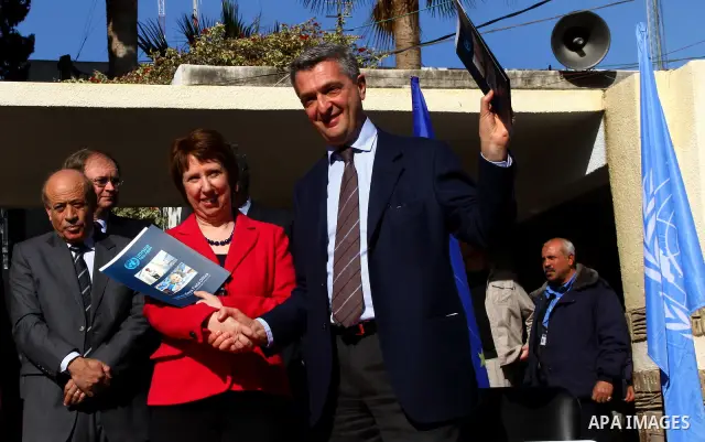 Catherine Ashton shakes hands with Filippo Grandi, Commissioner-General of the UN Relief and Works Agency (UNRWA), in Gaza City , on January 25, 2012. Ashton said that the informal talks between Israel and the Palestinia...