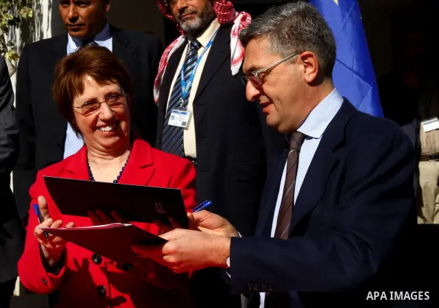 Catherine Ashton shakes hands with Filippo Grandi, Commissioner-General of the UN Relief and Works Agency (UNRWA), in Gaza City , on January 25, 2012. Ashton said that the informal talks between Israel and the Palestinia...