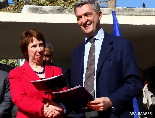 Catherine Ashton shakes hands with Filippo Grandi, Commissioner-General of the UN Relief and Works Agency (UNRWA), in Gaza City , on January 25, 2012. Ashton said that the informal talks between Israel and the Palestinia...