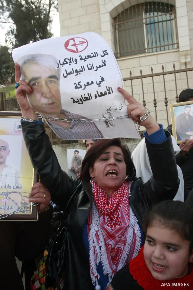 Palestinians participate in a demonstration calling for release of Palestinian prisoners held in the Israeli jails . in the West Bank city of Nablus, Jan. 25, 2012. Israel is currently holding thousands of Palestinians i...