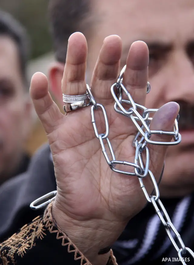 Palestinians participate in a demonstration calling for release of Palestinian prisoners held in the Israeli jails . in the West Bank city of Nablus, Jan. 25, 2012. Israel is currently holding thousands of Palestinians i...