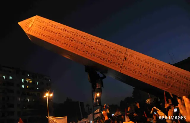 Egyptian demonstrators gather during a rally in Tahrir Square to mark the one year anniversary of the uprising that ousted President Hosni Mubarak in Cairo, Egypt, Wednesday, Jan. 25, 2012. Crowds of several hundred thou...