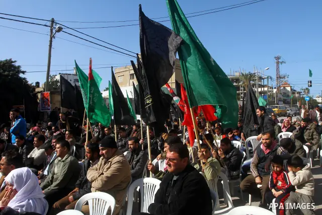 Palestinian Jihad Islamic supporters participate in a demonstration calling for release of Palestinian prisoners held in the Israeli jails at the Red Cross headquarters in Gaza City, on Jan. 24, 2012. Photo by Ashraf Amr...