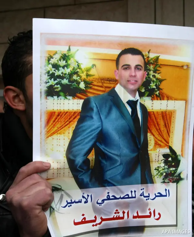 Palestinians participate in a demonstration calling for release of Journalist Raed Sharif, held in the Israeli jails . in the West Bank city of Hebron, Jan. 26, 2012. Israel is currently holding thousands of Palestinians...