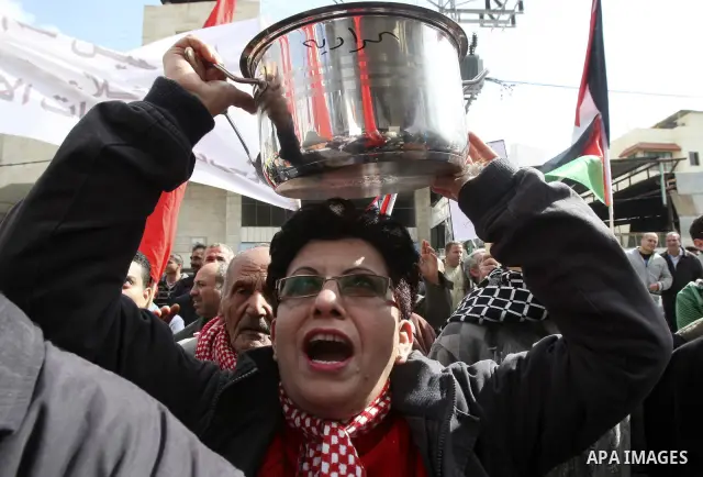 Palestinians protest against rising prices and taxes in the West Bank city of Tul Karem. Thursday, Jan. 26, 2012. Palestinian Authority Prime Minister Salam Fayyad has sparked a furor with a push to get Palestinians to p...