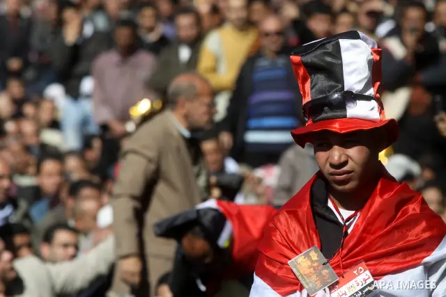 Egyptian demonstrators gather during a protest demanding the army to hand power to civilians at Tahrir square in Cairo on January 27, 2012, a year after a popular uprising. The protesters are demanding the implementation...