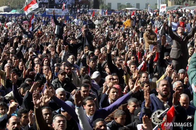 Egyptian demonstrators gather during a protest demanding the army to hand power to civilians at Tahrir square in Cairo on January 27, 2012, a year after a popular uprising. The protesters are demanding the implementation...