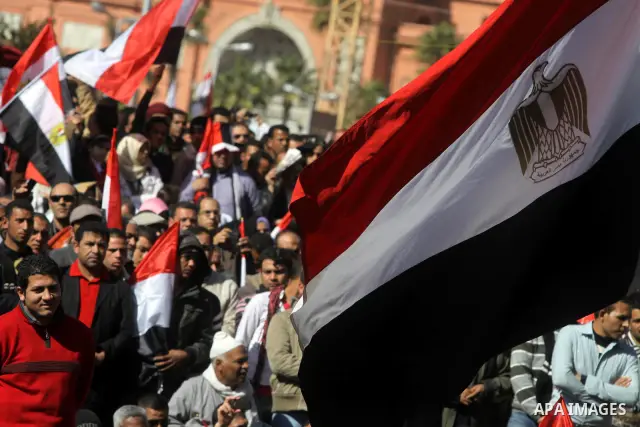 Egyptian demonstrators gather during a protest demanding the army to hand power to civilians at Tahrir square in Cairo on January 27, 2012, a year after a popular uprising. The protesters are demanding the implementation...