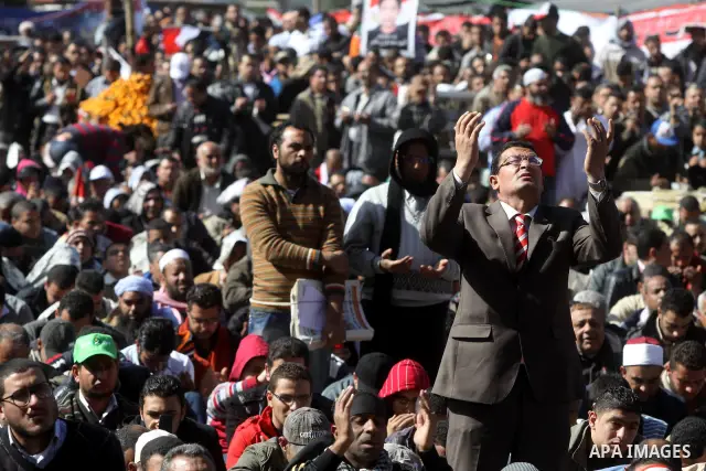 Egyptian demonstrators gather during a protest demanding the army to hand power to civilians at Tahrir square in Cairo on January 27, 2012, a year after a popular uprising. The protesters are demanding the implementation...