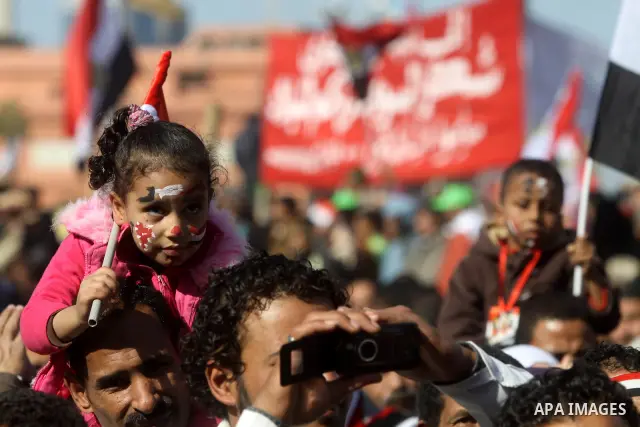 Egyptian demonstrators gather during a protest demanding the army to hand power to civilians at Tahrir square in Cairo on January 27, 2012, a year after a popular uprising. The protesters are demanding the implementation...