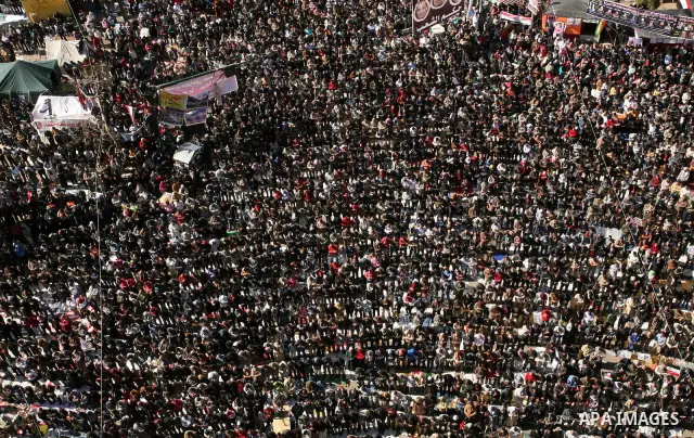 Egyptian demonstrators gather during a protest demanding the army to hand power to civilians at Tahrir square in Cairo on January 27, 2012, a year after a popular uprising. The protesters are demanding the implementation...