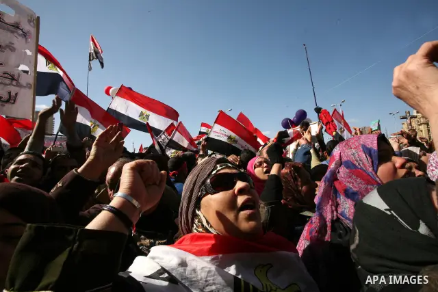 Egyptian demonstrators gather during a protest demanding the army to hand power to civilians at Tahrir square in Cairo on January 27, 2012, a year after a popular uprising. The protesters are demanding the implementation...
