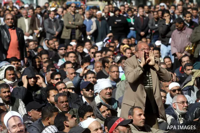 Egyptian demonstrators gather during a protest demanding the army to hand power to civilians at Tahrir square in Cairo on January 27, 2012, a year after a popular uprising. The protesters are demanding the implementation...