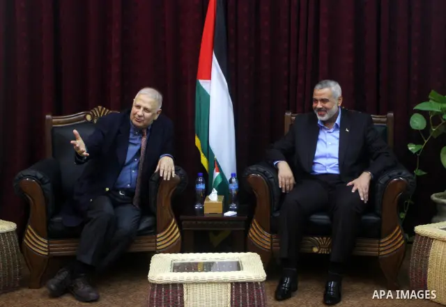Palestinian Prime Minister in Gaza Strip, Ismail Haniya Meet with the head of Central Elections Committee, Hanna Nasser, in Gaza city, on Jan. 29, 2012. Photo by Ashraf Amra